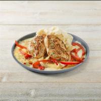 Sizzling Chicken & Cheese · Garlic-marinated chicken breasts served over melted cheese with onions, red bell peppers and...
