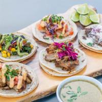 Five Tacos Deal · Select 5 tacos: chipotle chick, cochinito, garlic shrimp, the shorty, or vegan.