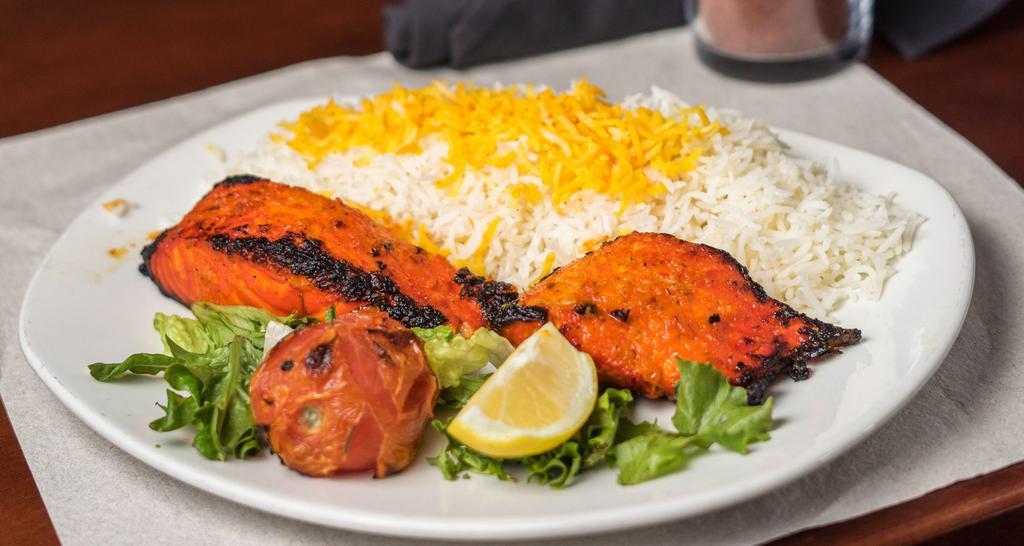 Salmon Kabob · Grilled and lightly marinated salmon, served with Baghala Polo (fava bean & dill saffron basmati rice).