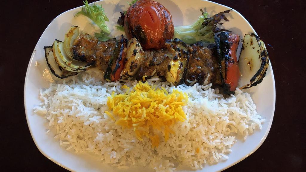 Shish Kabob · Marinated filet mignon and fresh market vegetables, cooked over an open flame and served with saffron basmati rice.