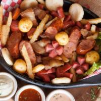 Picada Mixta · Sausage, pork skin, hot dog, quail eggs, mini corn patties, creole potato, and french fries.