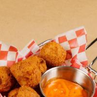 Hush Puppies · 10 pieces of savory, deep fried cornmeal-based batter