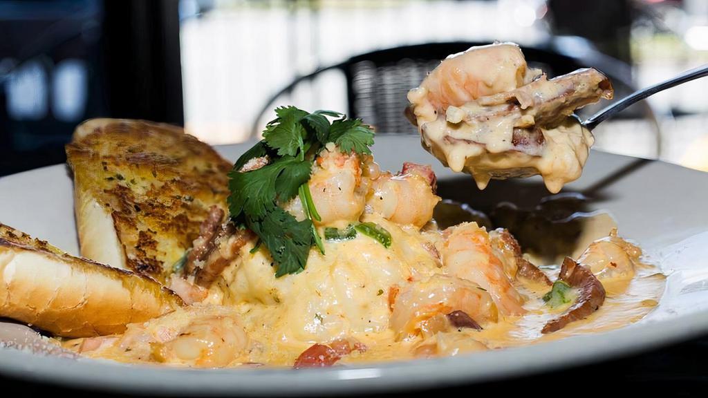 Shrimp & Grits · Grilled or blacked shrimp in a Southern sausage cream sauce served over creamy grits.
