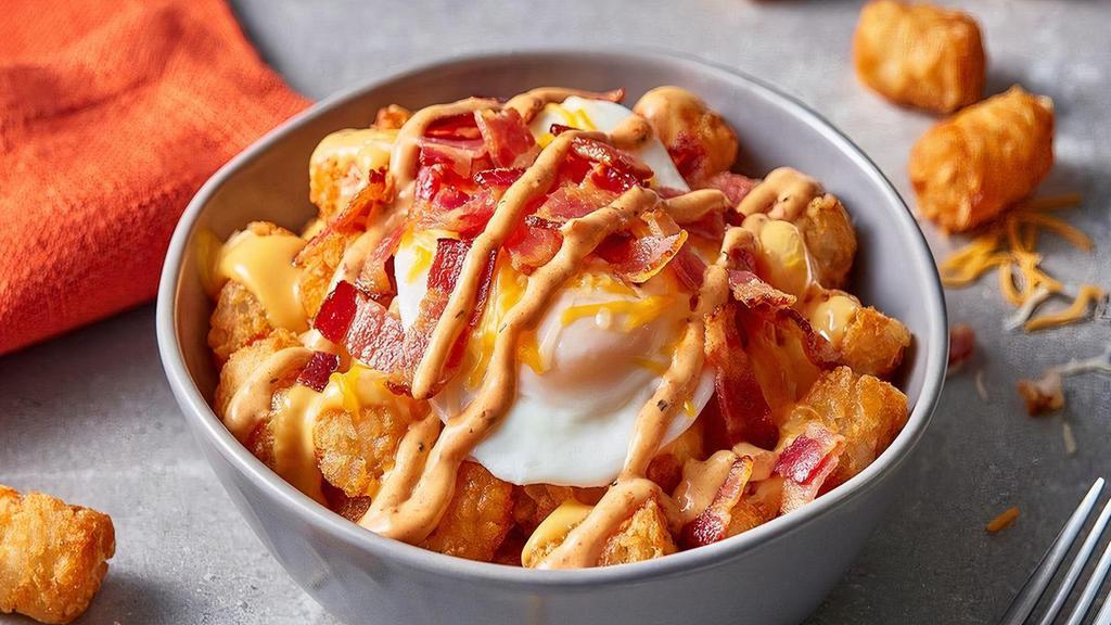 Papa'S Loaded Tots · The best Tots you’ve ever had. Papa’s Crispy Tots, smothered with chopped smoky bacon, a fried egg, melted blended cheese and topped with a red pepper sauce.