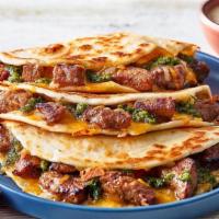 Papa Corazon’S Steak Quesadillas · Papa’s favorite. Marinated grilled skirt steak mixed with a melted blended cheese and a fres...
