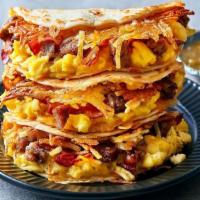 All-American Breakfast Quesadillas · Papa doesn’t care when you eat it. Three scrambled eggs, topped with hash browns, chopped sm...