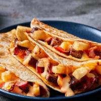 Burger & Fries Quesadillas · The only thing better than a burger and fries. A freshly-grilled burger, chopped and smother...