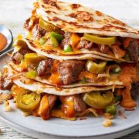Spicy Jalapeño Steak Quesadillas · Here’s where Papa brings the heat. Marinated grilled skirt steak mixed with diced jalapeños,...