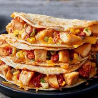 Chicken Fajita Quesadillas · Fajitas done Papa’s way. Marinated grilled chicken breast, fire-roasted corn, melted blended...