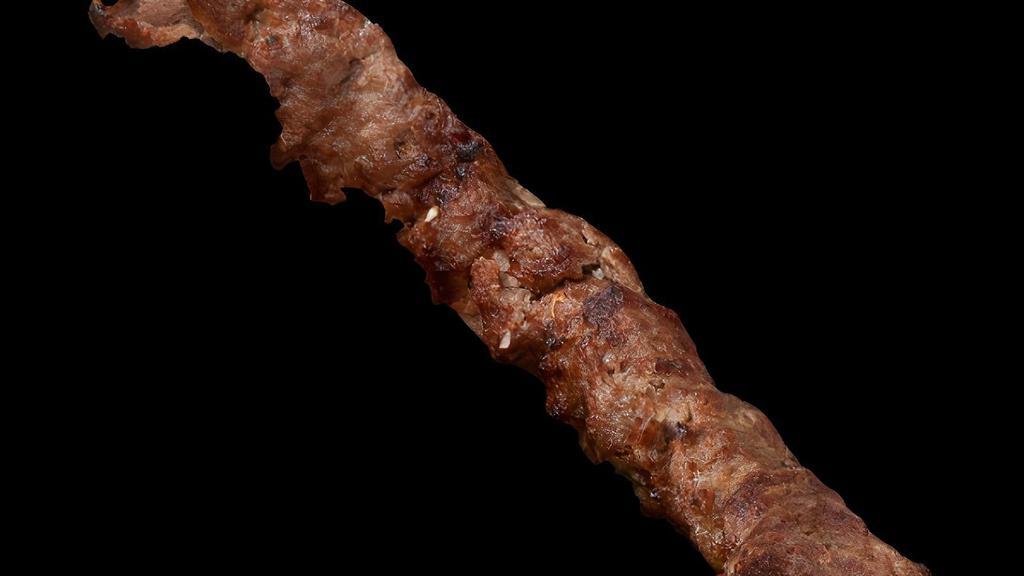 Ground Sirloin (Kubideh) Kabob · A juicy strip of ground sirloin steak marinated in our homemade seasoning and onions then char-broiled to perfection