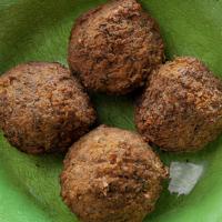 Falafels Single Serving (4 Units) · Four deep-fried balls made from ground chickpeas mixed with garlic, parsley and spices