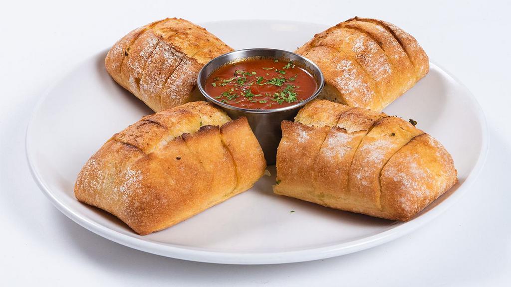 Garlic Cheese Bread · Add melted mozzarella to our buttered garlic bread and savor every chewy, cheesy bite. Comes with a side of marinara sauce.