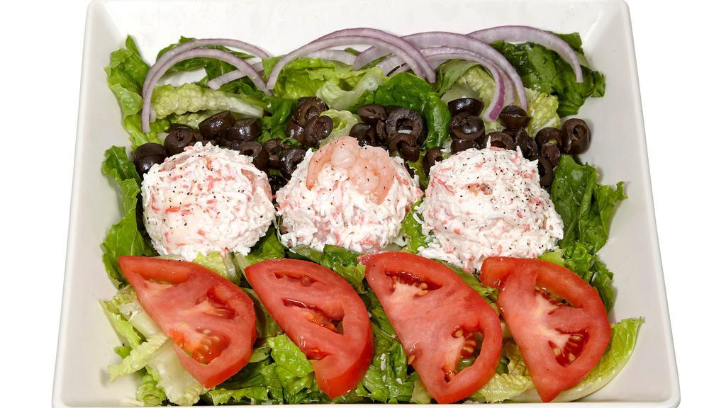 Seafood Salad · From the sea. Crab and shrimp salad, mix green, tomato, chopped onions, black olives and light mayo.