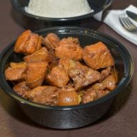 Pork Adobo · A dish composed of pork slices cooked in soy sauce, vinegar, garlic, and onions.