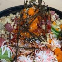 Poke Bowl · Served with lettuce seaweed salad masago crab meat avocado cucumber pineapple ginger wasabi ...