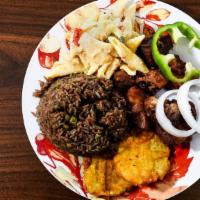 Griot (Fried Pork) · Seasoned pork shoulders fried to perfection and topped with onion and bell pepper vinaigrett...