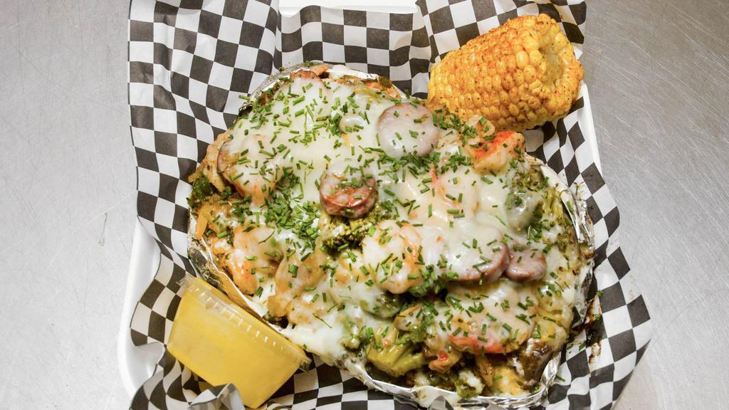 Seafood Potato · Crabmeat, shrimp, Beef sausage, broccoli, green pepper, onions, side of corn, and garlic butter.
