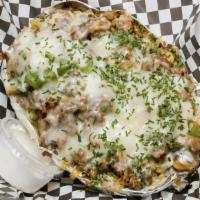 Philly Cheesesteak Potato · Philly steak or chicken, green peppers, onions, mushrooms, cheese, and chives.