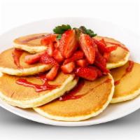 Strawberry Pancakes. · 6 buttermilk pancakes topped with fresh strawberries,. whipped cream, powdered sugar and hom...