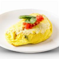 Greek Omelette · Tomatoes, fresh spinach & feta cheese. Served with Pancakes or Toast.