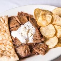 Souvlaki Plate · Chunks of sirloin steak, tzatziki sauce, Feta cheese, Greek salad, Greek potatoes, and pita ...