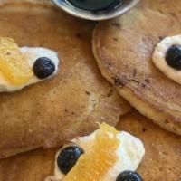 Lemon Poppy Ricotta Pancakes · Agave Nectar, Blueberry & Orange Relish.