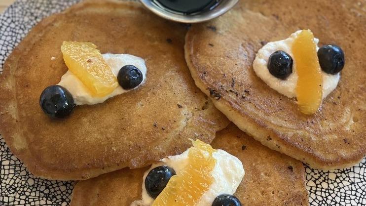 Lemon Poppy Ricotta Pancakes · Agave Nectar, Blueberry & Orange Relish.