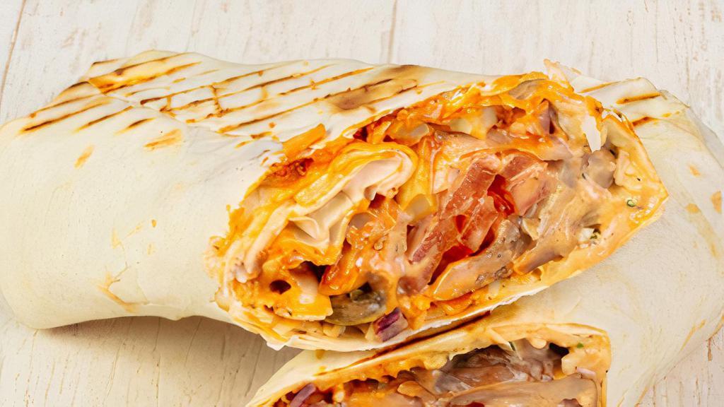  Breakfast Burrito · Two eggs,  bacon,  ham, hash brown, cheese .wrapped in tortilla bead
