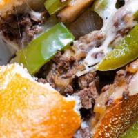  Philly Cheesesteak Sandwich · 6 oz of meat, onion, mushroom, cheese, green pepper.