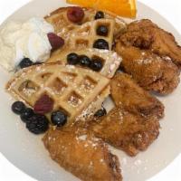 Chicken & Waffles · Fried Golden Chicken and a Belgian Waffle served with strawberry butter