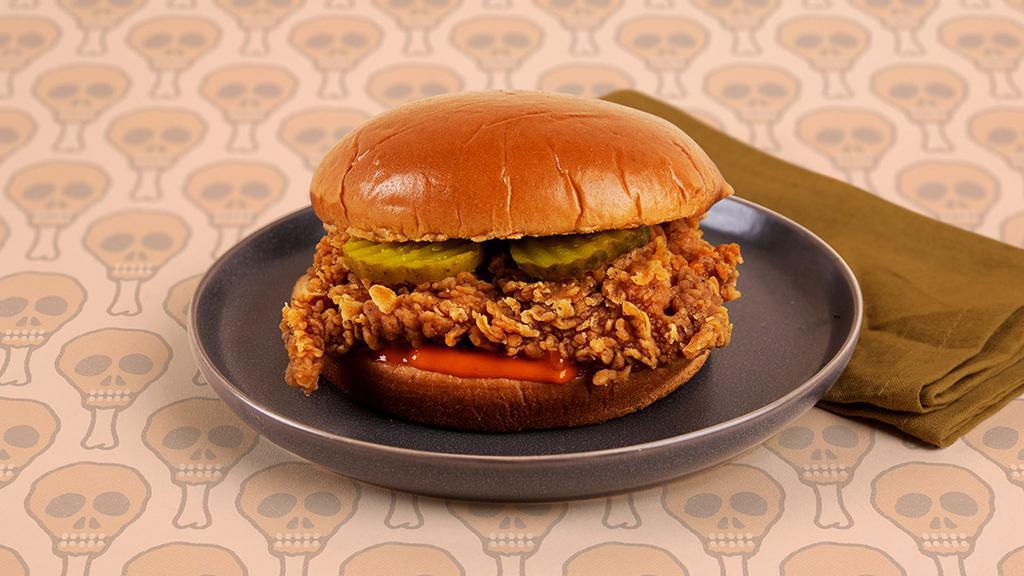 Fried Chicken Sandwich · Crispy fried chicken breast with pickles and mayo on a toasted bun.