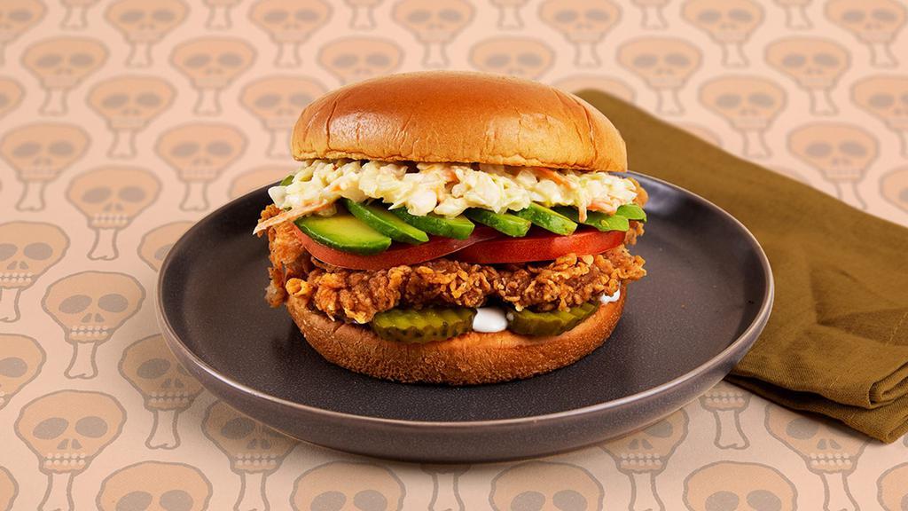 Deluxe Fried Chicken Sandwich · Crispy fried chicken breast with tomatoes, coleslaw, pickles, and ranch on a buttery brioche bun.
