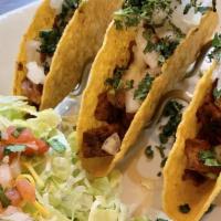 Tacos Al Pastor · Specially marinated pork loin grilled with pineapples and topped with Cilantro and onions. R...