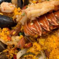 Seafood Paella · Spanish Chorizo-Saffron Rice, Lobster Tail, Scallops, Shrimp, Mussels, Red Bell Peppers, Gre...