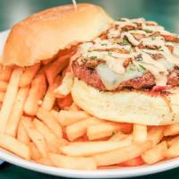 Mushroom Swiss Burger · 1/2 lb burger patty topped with savory grilled onions, mushrooms, and secret burger sauce on...