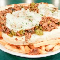 Famous Philly Sandwich · Philly sandwich with steak or chicken, grilled onions, peppers, and your choice of cheese pl...