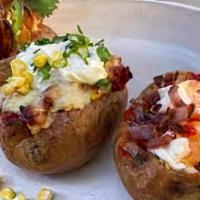 Loaded Potato · Melted cheddar, bacon, and chives. Served with a buttered roll.