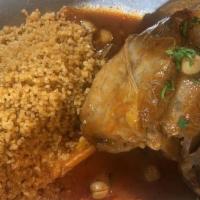 Braised Lamb Shank · Lamb shank cooked with own lamb juice, served with rice pilaf, steamed vegetables and light ...