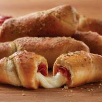 Pepperoni Twist (6) · Twisted daily. Fresh Italian dough wrapped around pepperoni and mozzarella sprinkled with ma...