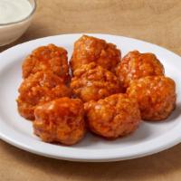 Boneless Wings (10) · freshly baked boneless chicken  with your choice of flavor, and a side of dressing