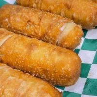 Mini Tequeños · 5 mini tequeños
Tequenos are breaded fingers filled with mozzarella cheese.