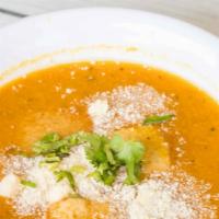Creamy Pumpkin Soup (Sopa De Auyama) · With croutons and parmesan cheese.