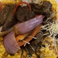 Huancaina Risotto With Beef Tenderloin · Bite-size tenderloin strips with risotto on bechamel huancaina paste (creamy cheese, yellow ...
