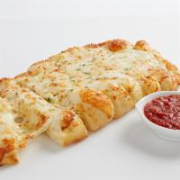 Garlic Cheesy Bread · Homemade dough brushed with garlic butter and 100% whole milk mozzarella.