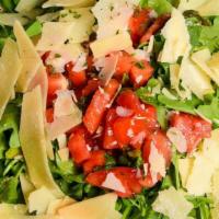 Napoli Salad · Arugula, chopped tomatoes, basil, garlic, shaved parmesan