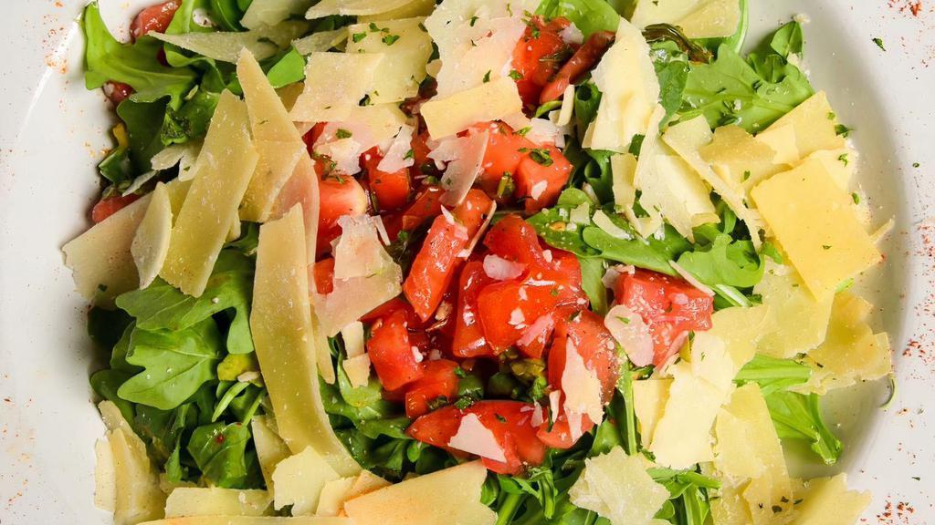 Napoli Salad · Vegetarian. Arugula, chopped tomatoes, basil, garlic, shaved parmesan