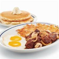 Sirloin Steak Tips & Eggs · Sirloin steak tips* with grilled onions & mushrooms. Served with 2 eggs* your way, golden ha...