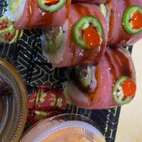 Fuego Roll · Spicy tuna, avocado, cucumber, scallion, cilantro, parsley, tuna on top, jalapeño. Sriracha.