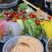 Rainbow Roll · Kani, avocado, cucumber, with salmon, kani, tuna, white fish, avocado and mango on top.