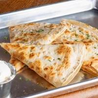 Quesadilla · flat grill pressed flour tortillas, shredded cheese blend, served with a side of salsa and s...